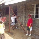 Armand, Mike and Russell waiting for building instructions in Nakuru Kenya