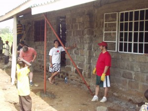 Armand, Mike and Russell waiting for building instructions in Nakuru Kenya