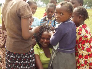 World Teacher Aid Kenya Connection Irene getting her hair done