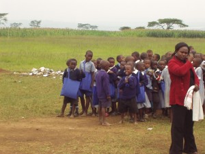 Kenyan students with their school supplies from World Teacher Aid