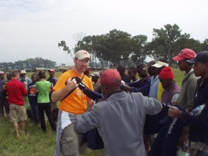 Handing out yet even more Solvay Concert band t-shirts to Kenyan work crew