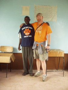 Kenyan Science Teacher and Dave Gardner on World Teacher Aid trip with new Solvay t-shirts